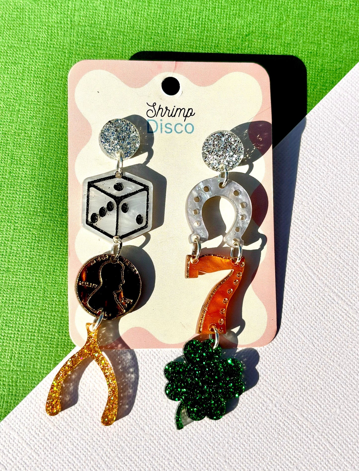 Good luck charm mismatched glitter statement earrings